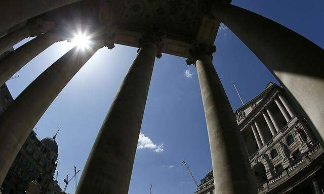 The Bank of England is seen through columns in London