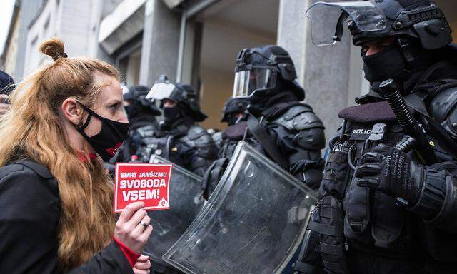 April 27, 2021, Ljubljana, Slovenia: A protester holding a sticker saying Death to Jansism, freedom for all, referring