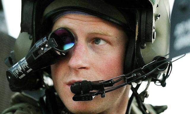 Britain´s Prince Harry wears his monocle gun sight as he sits in his Apache helicopter at Camp Bastion, southern Afghanistan