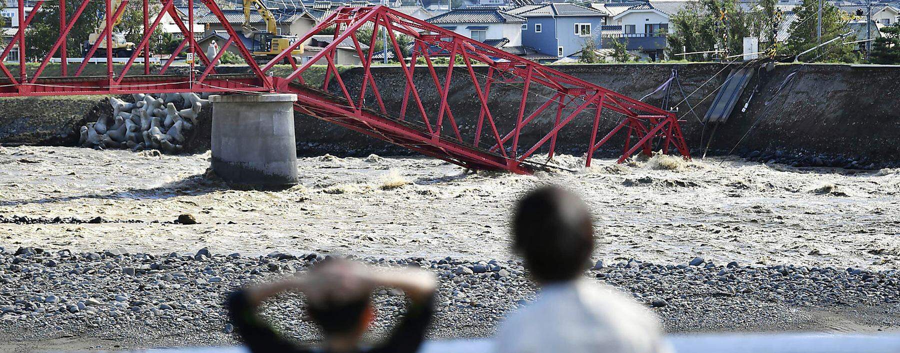 Destroyed houses, cars and power poles, which according to local media were believed to be caused by a tornado, are seen as Typhoon Hagibis approaches the Tokyo area in Ichihara