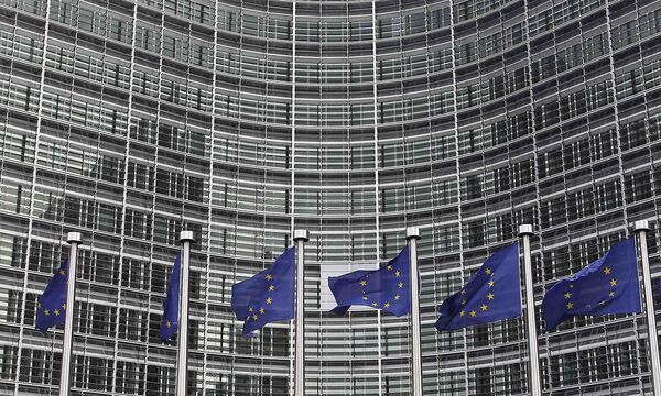 EU flags are seen outside the EU Commission headquarters in Brussels