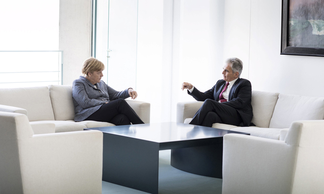 German Chancellor Merkel talks to Austrian Chancellor Faymann at the chancellery in Berlin