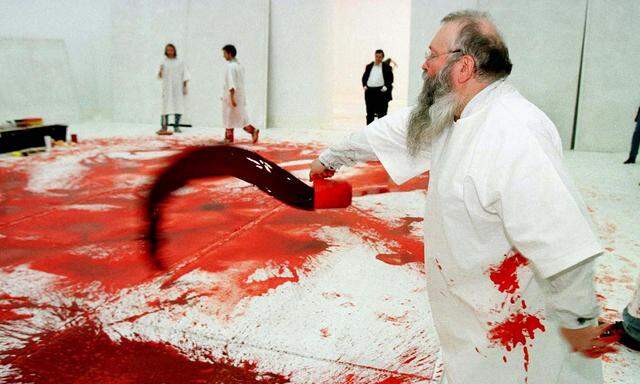 Austrian artist Hermann Nitsch is at work during his 40th ´blood and black paint´ happening in Vienn..