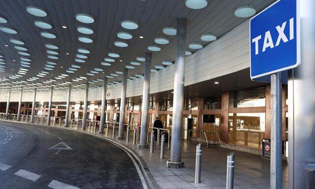 An empty airport taxi stop is seen during a strike by taxi drivers to protest what they say is unfair competition from new car sharing companies such as Uber and Cabify, at the airport in Madrid