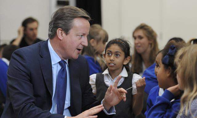 Britain´s Prime Minister David Cameron speaks to pupils during a visit to Reach Academy Feltham, in south west London