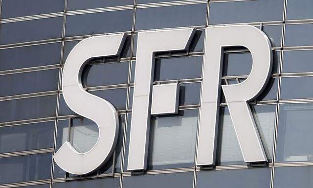 The logo of French telecom operator SFR is seen on a building in the financial district of le Defense at Nanterre, west of Paris