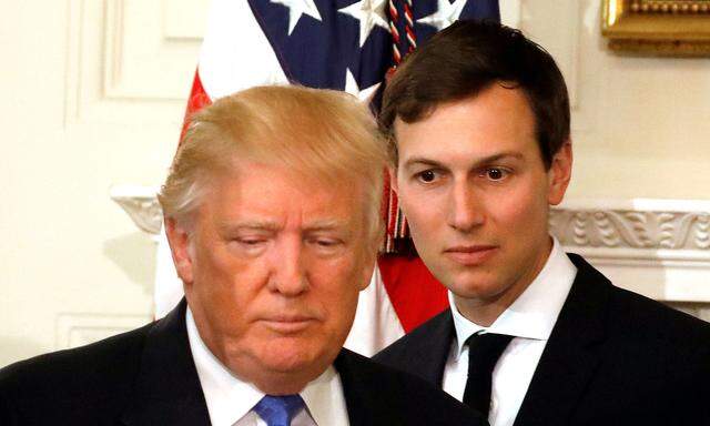 FILE PHOTO - U.S. President Donald Trump and his senior advisor Jared Kushner arrive for a meeting with manufacturing CEOs at the White House in Washington