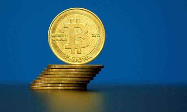 FILE PHOTO: An illustration photo of Bitcoin (virtual currency) coins are seen at La Maison du Bitcoin in Paris