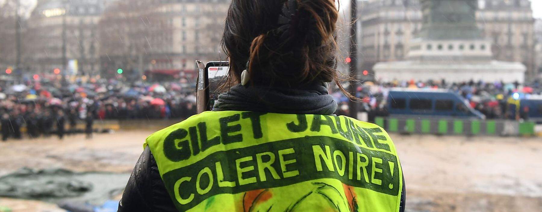 A dog with a yellow scarf is seen as protesters wearing yellow vests take part in a demonstration of the ´yellow vests´ movement in Marseille