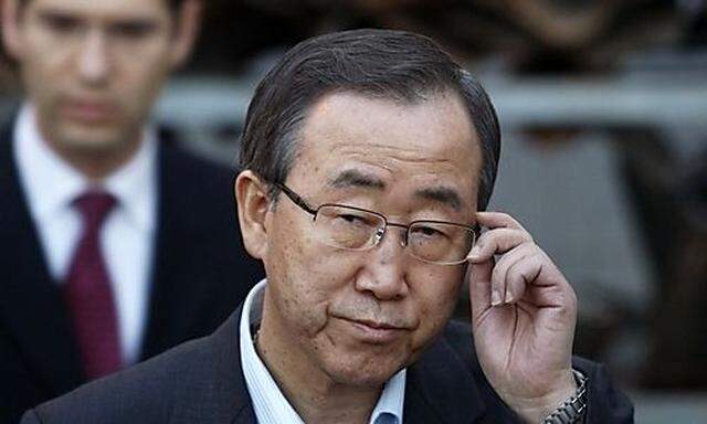 U.N. Secretary-General Ban Ki-moon stands in front of the remains of rockets fired by Palestinian mil