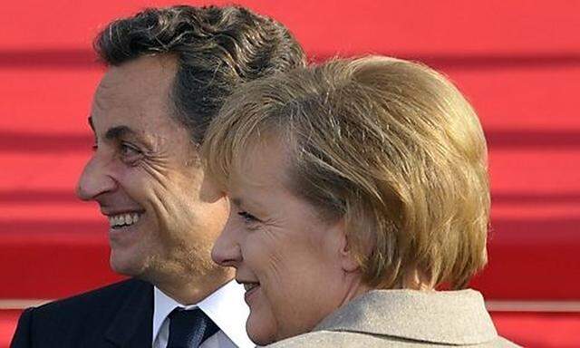 Frances President Nicolas Sarkozy welcomes German Chancellor Angela Merkel in Deauvilles President Nicolas Sarkozy welcomes German Chancellor Angela Merkel in Deauville