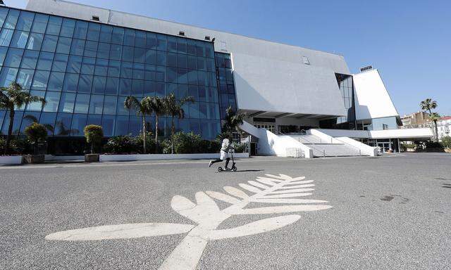 A man skates past a Palme d´Or symbol on the pavement near the Festival palace on the Croisette in Cannes where the Cannes Film Festival and the Cannes Lions take place, as a lockdown is imposed to slow the rate of the coronavirus disease (COVID-19)