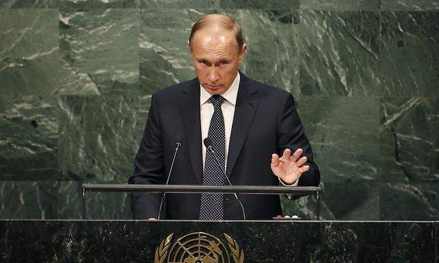 Russian President Vladimir Putin addresses attendees during the 70th session of the United Nations General Assembly at the U.N. Headquarters in New York