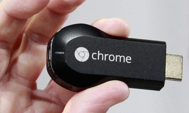 Mario Queiroz, vice president of product management, holds the new Google Chromecast dongle as it is announced during a Google event at Dogpatch Studio in San Francisco