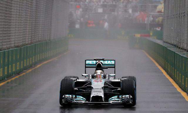 Mercedes Formula One driver Hamilton of Britain drives into the pit lane during the qualifying session for the Australian F1 Grand Prix in Melbourne