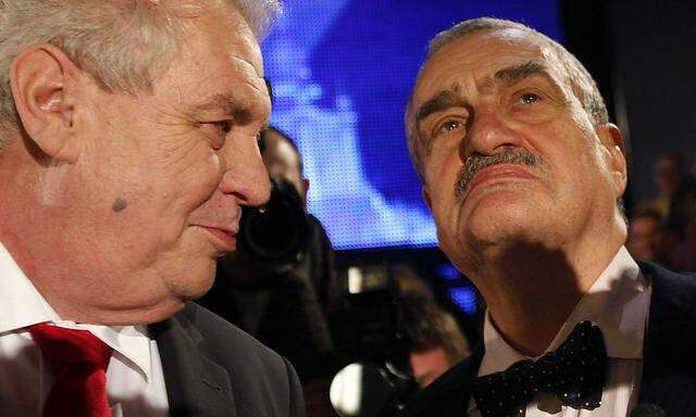 Czech presidential candidates Schwarzenberg and Zeman chat before a televised debate in Prague