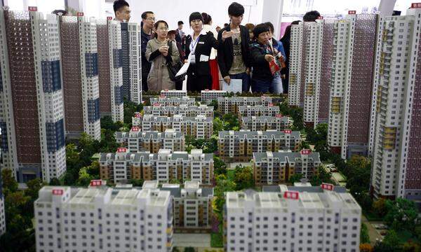 Ausgeträumt: Viele halb fertige Häuser belasten Chinas Kommunen.