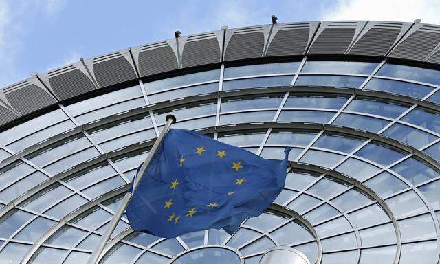 An European Union flag flutters outside of the European Parliament in Brussels