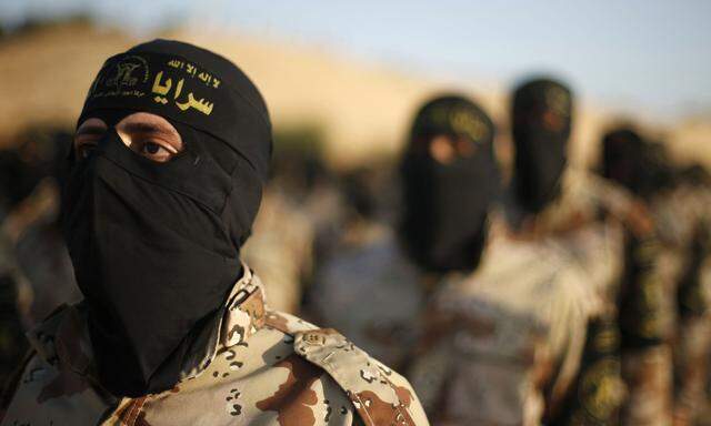 Palestinian Islamic Jihad militants march during a military drill in the southern Gaza Strip