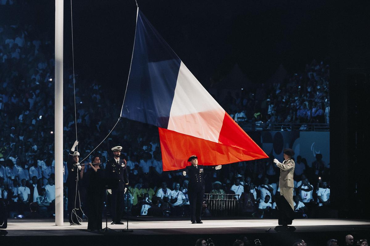 Raising the French flag.