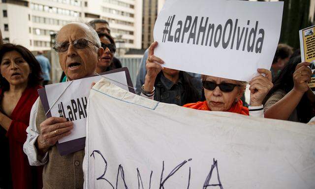 Activists from ´The Mortgage Victims´ Association´, or PAH by its initials in Spanish, protest in front of Spanish courts in Madrid, Spain