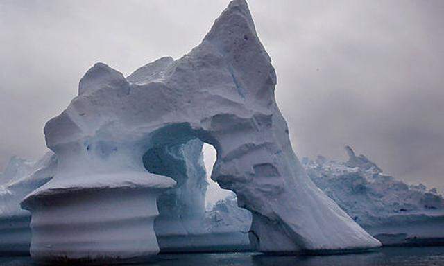 ** FILE ** An iceberg melts off Ammassalik Island in Eastern Greenland in this July 19, 2007 file pho