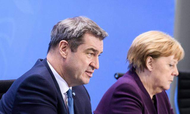 Söder und Merkel: uneins über Kaufprämie