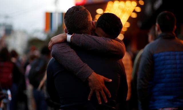 Ahmed Zaeem embraces Billy Quimby, both of San Francisco, while attending a candlelight vigil for the victims of the Orlando attack against a gay night club, held in San Francisco