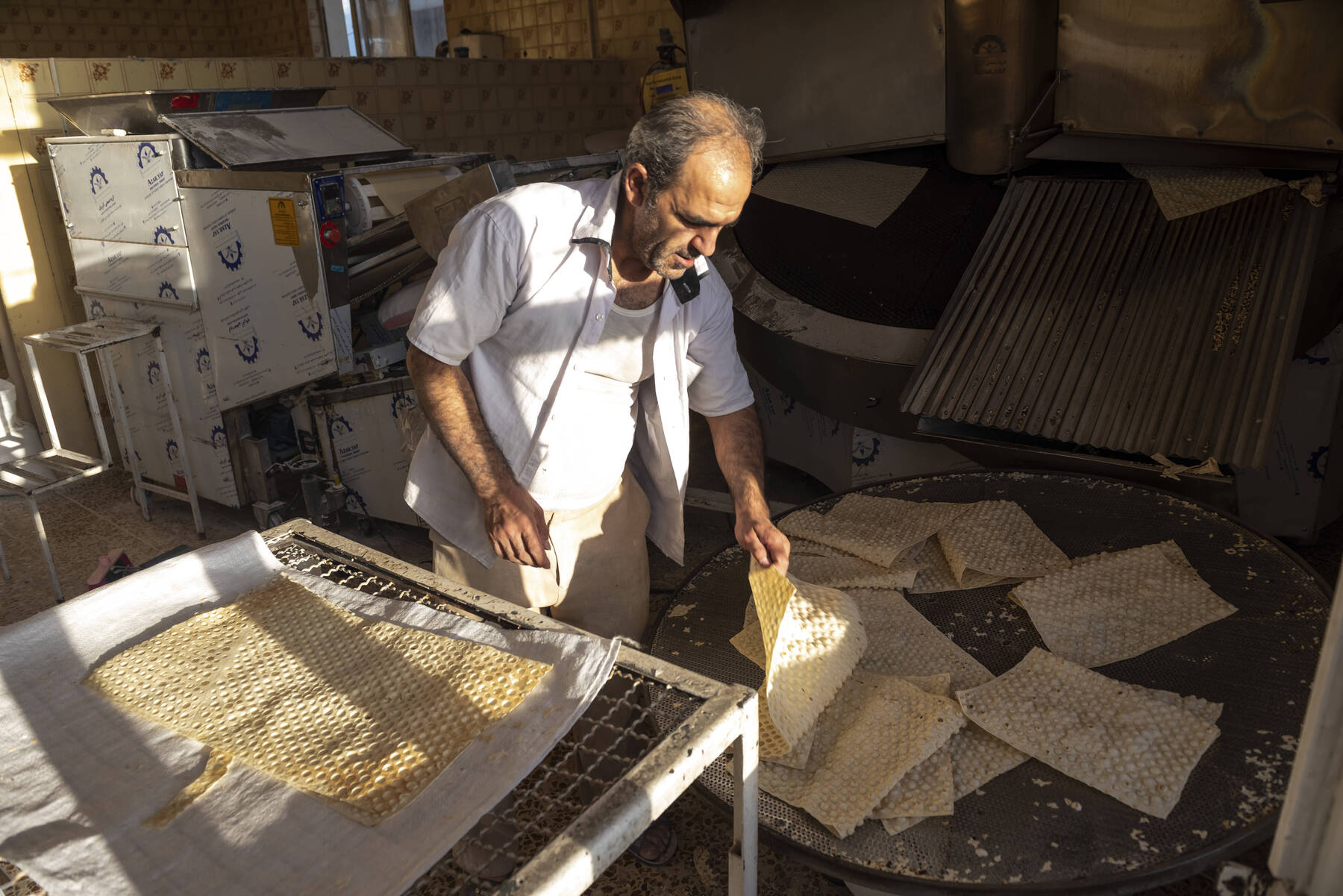 Tehran baker fights hunger amid Iran's converging crises