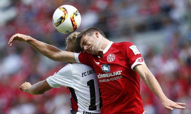 FC Ingolstadt's Hinterseer and Mainz's Bell fight for the ball during their German first division Bundesliga soccer match in Mainz