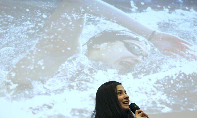 Syrian swimmer Mardini attends a news conference in Berlin