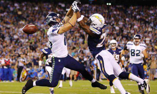 San Diego Chargers' Williams breaks-up a touchdown pass to Seattle Seahawks' Swain during their pre-season NFL football game in San Diego