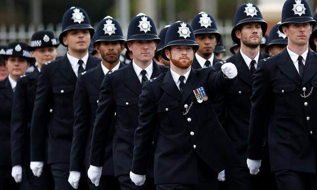 New Police recruits take part in a passing-out parade at the new ´Peel Centre´ at the Metropolitan Police Academy in London