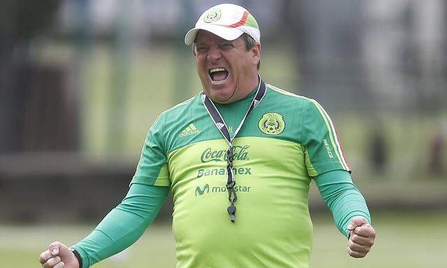 Mexico's coach Herrera gestures during a practice session in Mexico City