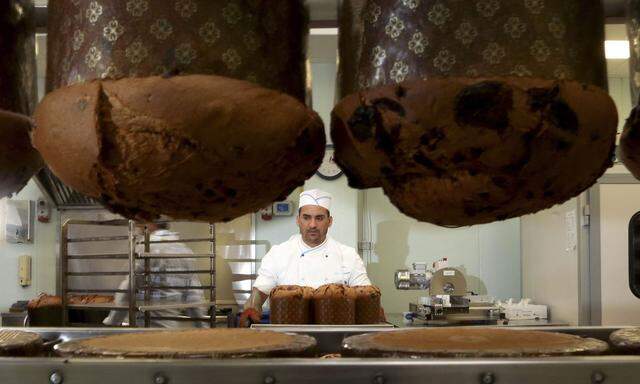 A prison baker prepares panettone cakes at Pasticceria Giotto in Padua's Due Palazzi prison