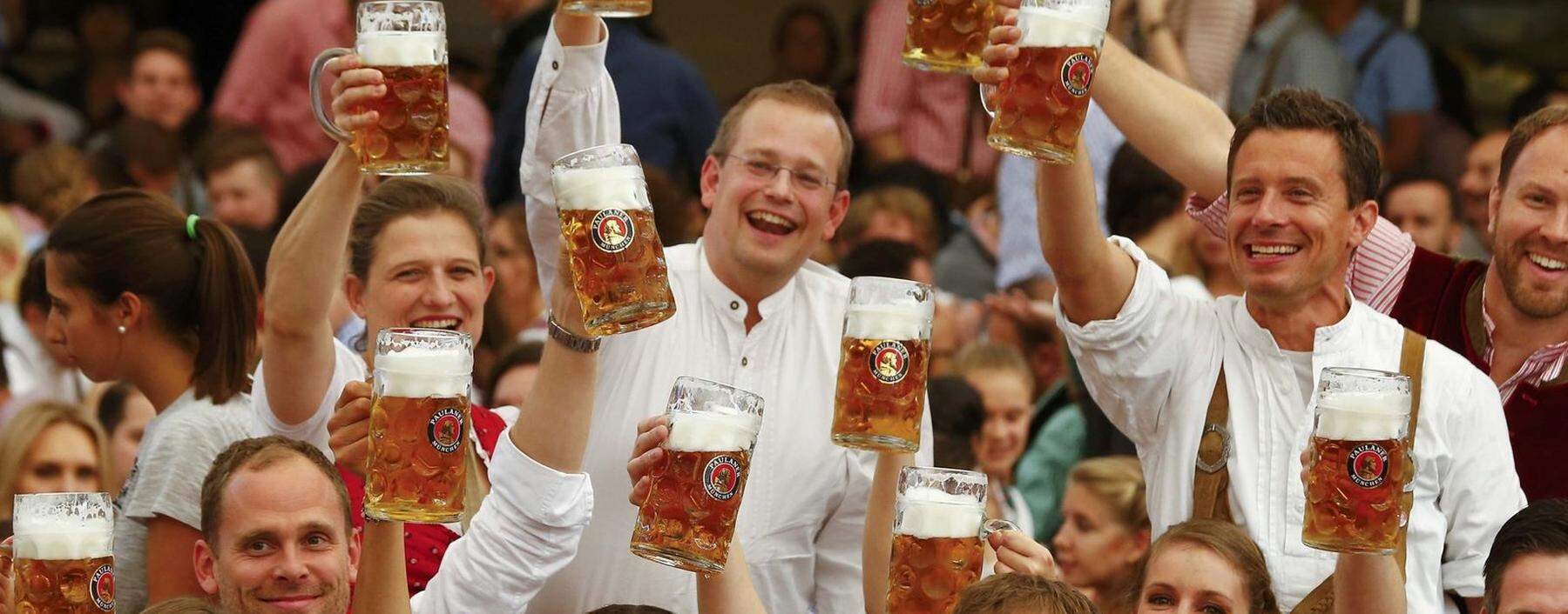 FILE PHOTO: A waiter carries glasses of beer during the opening day of Oktoberfest in Munich