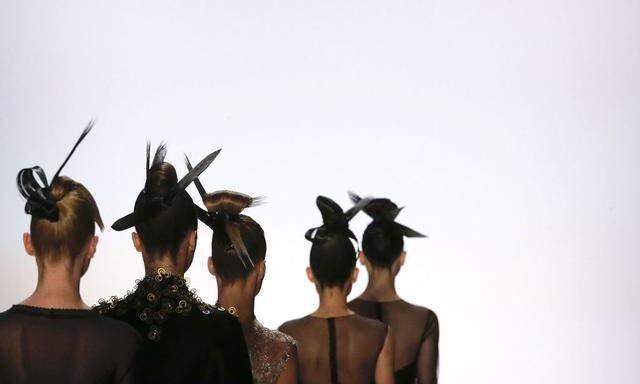 Models have special hairstyle as they present a collection by Irene Luft at the Berlin Fashion Week Autumn/Winter 2016 in Berlin