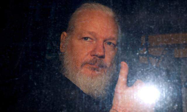 WikiLeaks founder Julian Assange is seen as he leaves a police station in London