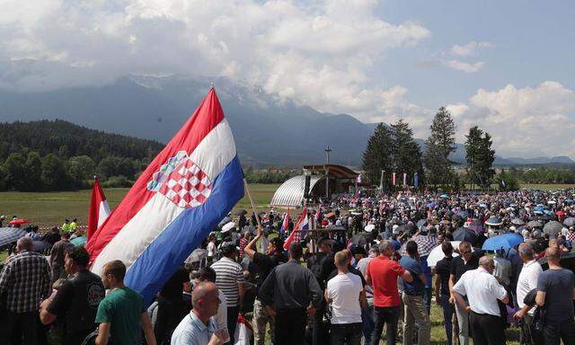 Participants take part in a Catholic ceremony commemorating the turning away from Austria of pro-Nazi Croatians at the end of World War Two in Bleiburg