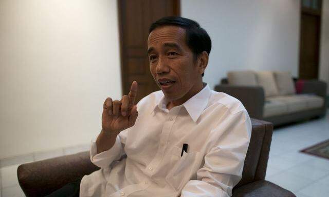 Indonesia's presidential candidate Joko 'Jokowi' Widodo gestures during an interview with Reuters in Jakarta