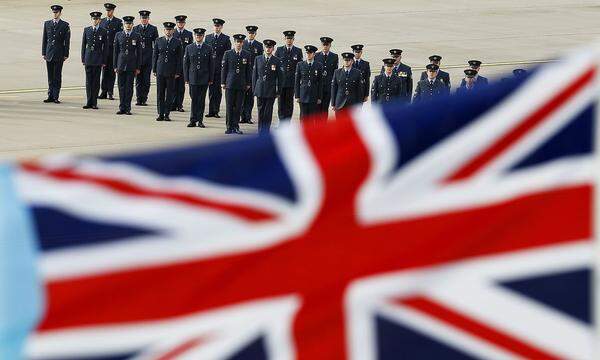 Members of Britain's Royal Air Force 111 Squadron carry out a disbandment parade at RAF Leuchars in Fife