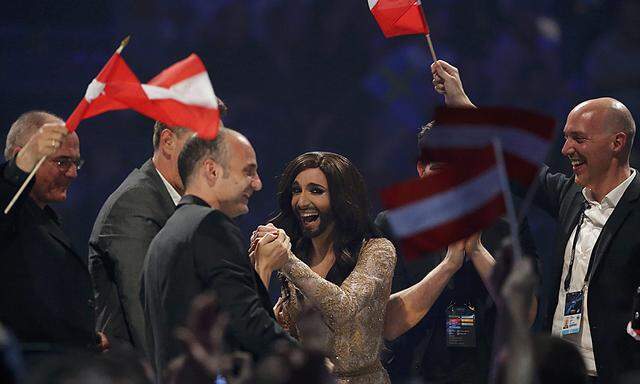Conchita Wurst representing Austria reacts as preliminary resulsts are announced during grand final of the 59th Eurovision Song Contest in Copenhagen