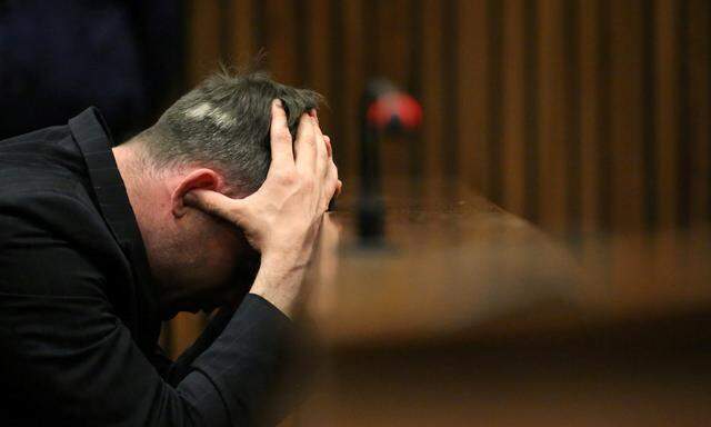 Oscar Pistorius reacts during third day of resentencing hearing for 2013 murder of girlfriend Reeva Steenkamp, at Pretoria High Court