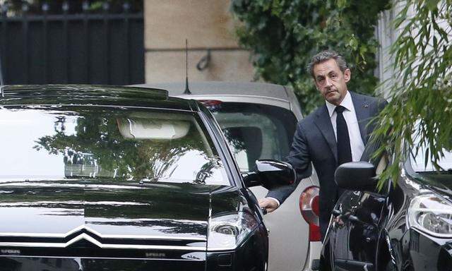 Former French President Sarkozy leaves his residence in Paris