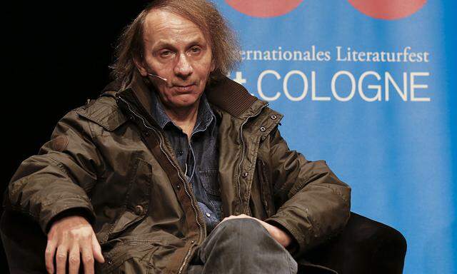 French author Houellebecq sits on stage of the Schauspiel Koeln, the public theater of the western German city of Cologne