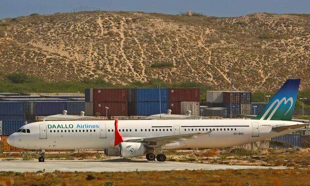 An aircraft belonging to Daallo Airlines is parked at the Aden Abdulle international airport after making an emergency landing following a bomb explosion inside the plane in Somalia's capital Mogadishu