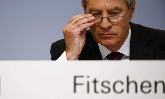 Fitschen, co-CEO of Deutsche Bank, looks down during a news conference in Frankfurt