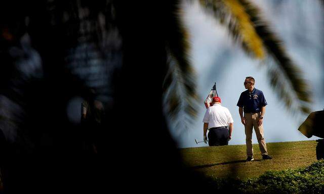 U.S. President Donald Trump plays golf at the Trump International Golf Club in West Palm Beach