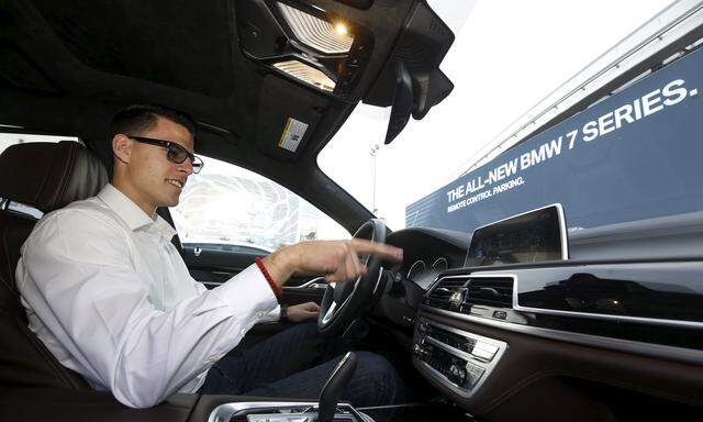 BMW´s Vlatko Kalinic demonstrates a gesture control feature to control the radio volume in a 2016 BMW 750i sedan during the 2016 CES trade show in Las Vegas