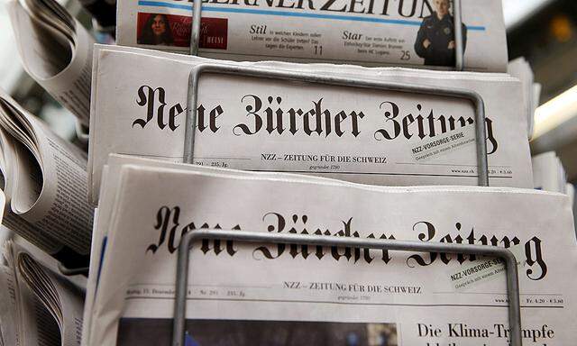 Swiss newspapers Neue Zuercher Zeitung are seen at a kiosk in Zurich